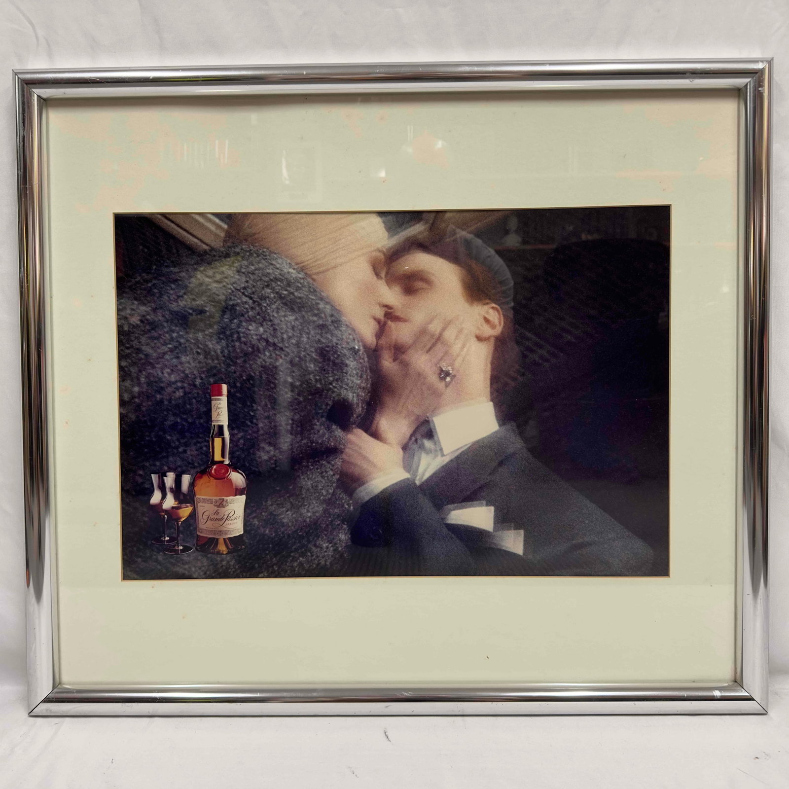 La Grande Passion Liqueur Print Ad Advertising Framed: La Grande Passion Liqueur Print Ad Advertising Framed. Liquor ad print in a silver frame. The frame is a little nicked up on the corners and a few scratches. Backing paper of frame has some tears,