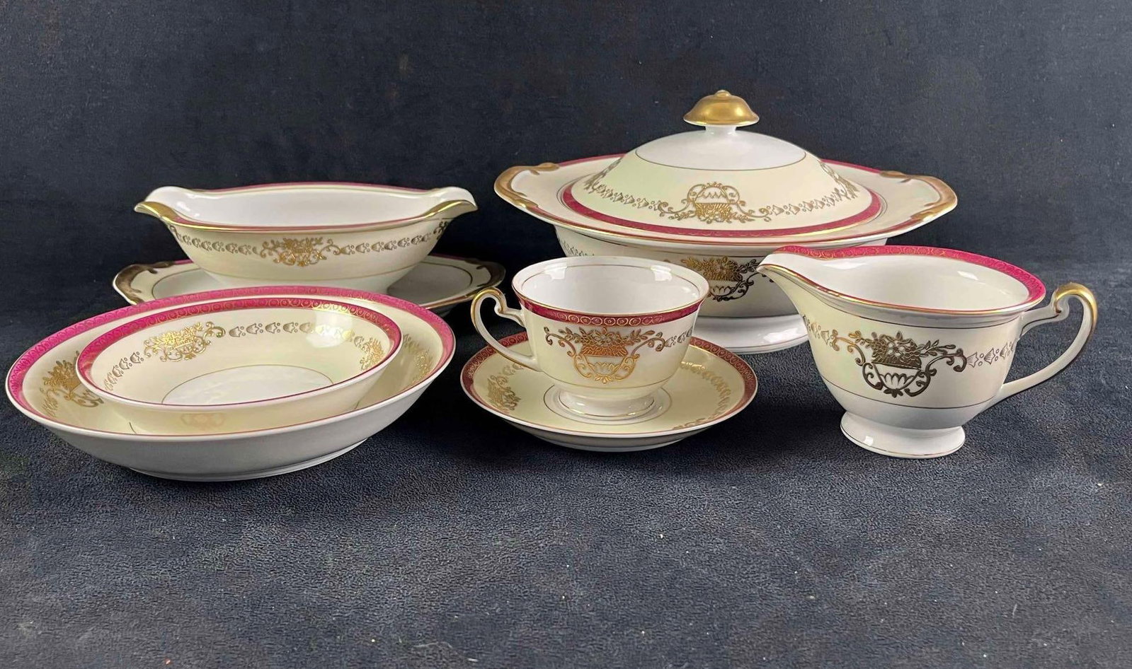 China Set White China with Red and Gold Design: China Set White China with Red and Gold Design This is a 50pc china set that has "Made in Japan" on the bottom with no brand stamp. This is a great small set that has elegant red and gold desi