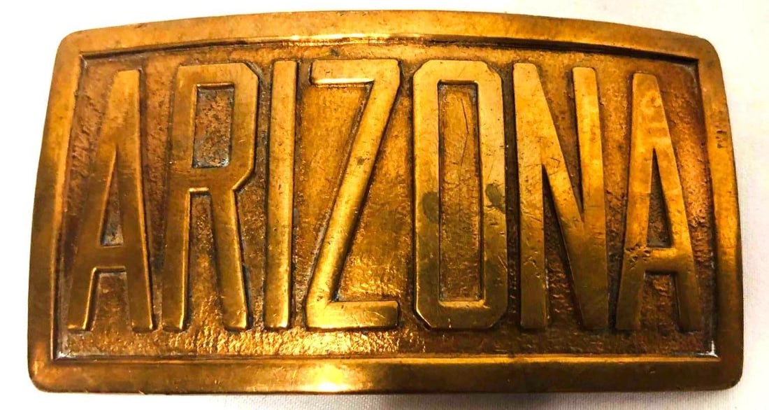 Vintage Robbins Co. Attleberg Arizona Belt Buckle Pat3-8-27: This lot contains Vintage Robbins Co. Attleberg Arizona Belt Buckle Pat3-8-27. It is approx 1 3/4" x 3 1/4" x 1/4" and it weighs about 0.1lbs. Overall the belt buckle is in good used condition with