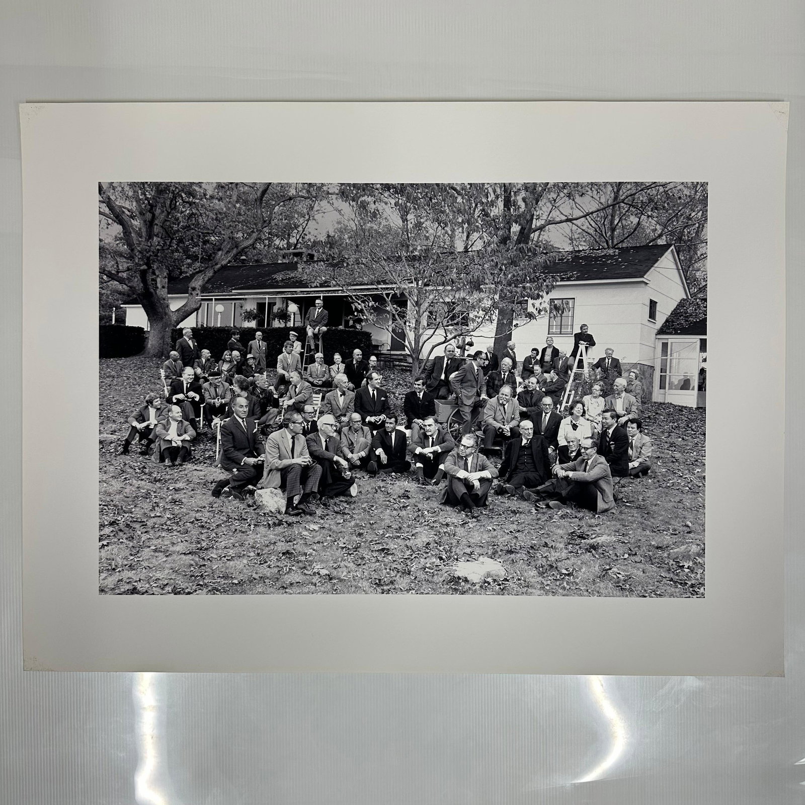 Famous Artists School Faculty Group Portrait High Quality Lithograph Print: Black and white lithograph print depicting a large group of artists, illustrators, and faculty of the Famous Artists School gathered outside Stevan Dohanos’ home on Sturges Highway. The scene sh