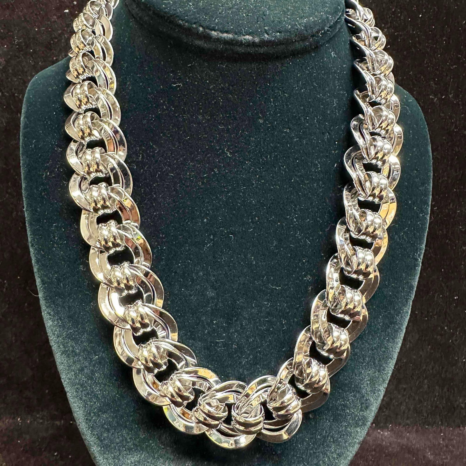 Monet Heavy Double Link Curb Chain Silver Toned Necklace D80: Signed Monet. The necklace features a j hook clasp closure. This vintage silver toned chain necklace features a bold and intricate link design, offering a striking and timeless piece of jewelry. This 