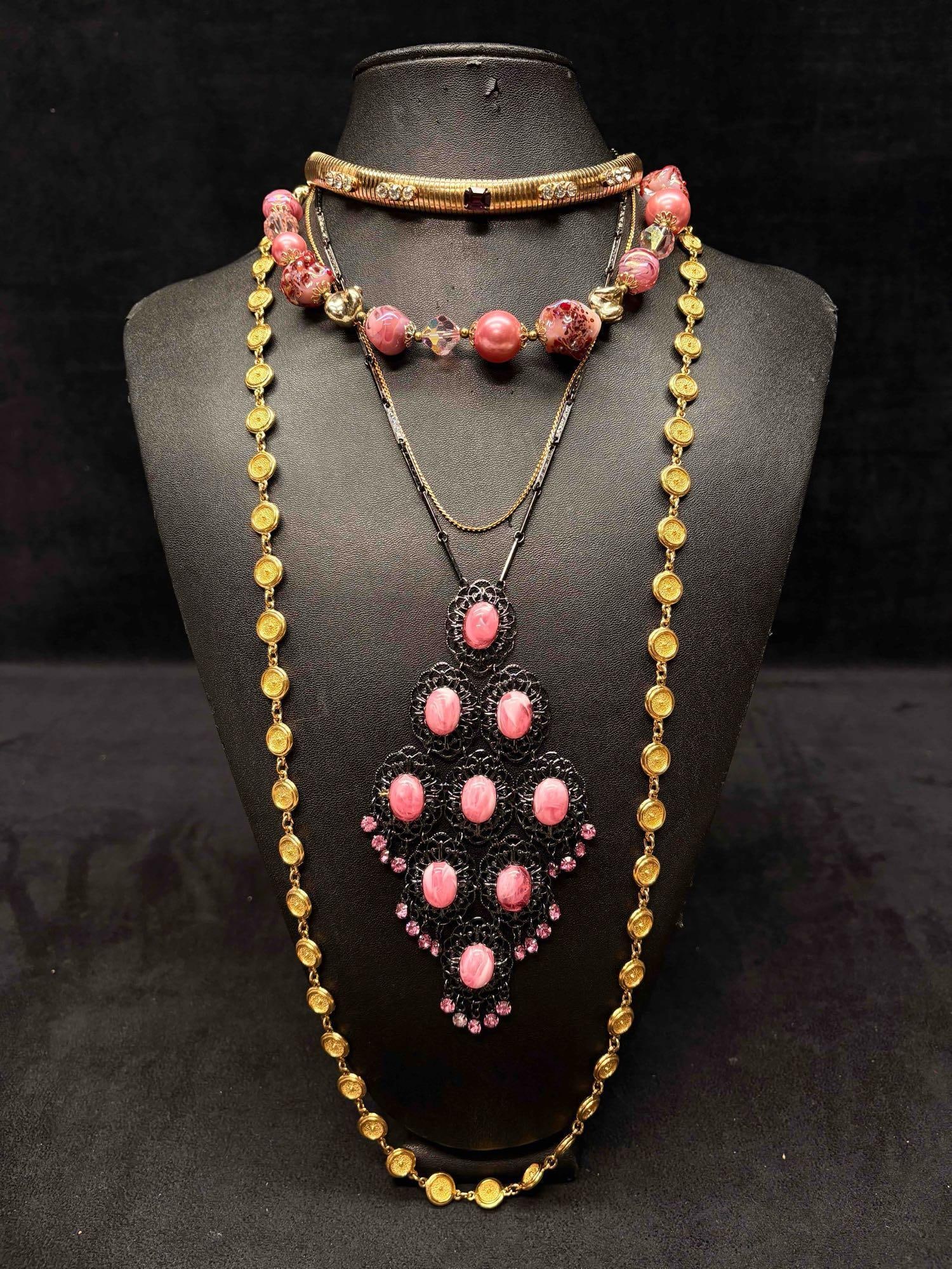5pc Pink Black and Gold Carnival Themed Necklace Lot: This lot consists of 5 pre-owned costume jewelry necklaces with typical wear from use. Please review images for context of the lots visual conditions. APPROX. WEIGHT: 7.2 OZ