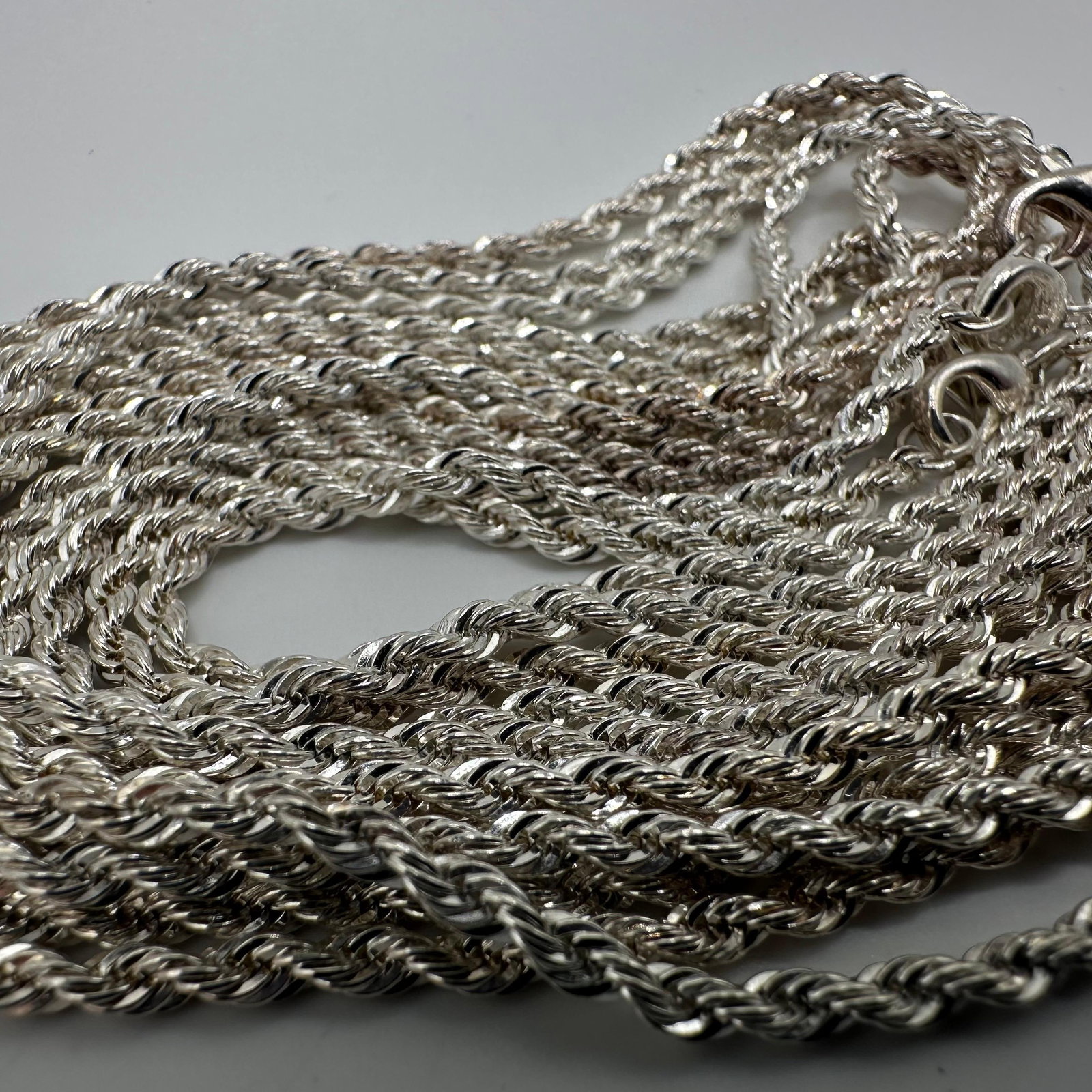 Silver Plated Twist French Rope Style Chain Necklace 3 Pieces: Set of three twist French rope style 30 1/4" length chain necklaces. No hallmarks. These items are in good pre-owned, previously displayed condition with light wear and surface scratches. Please