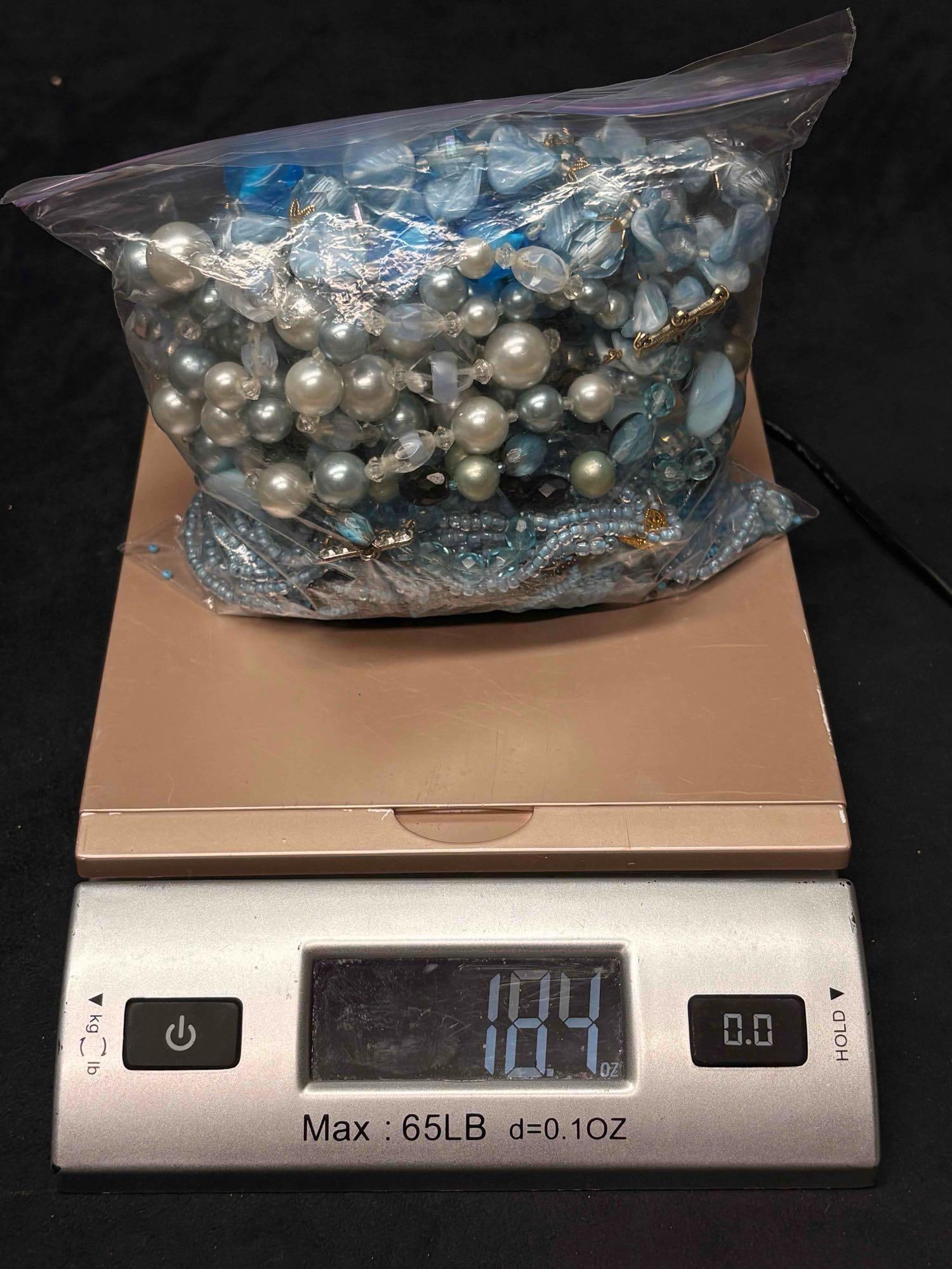1.15 LB of Broken Blue Beaded Necklaces for Crafting: This lot consists of over 1 pound of randomly assorted beaded necklaces, earrings, and charms. These beaded jewelry can be dismantled and reused for crafting purposes. APPROX WEIGHT: 18.4 OZ or 