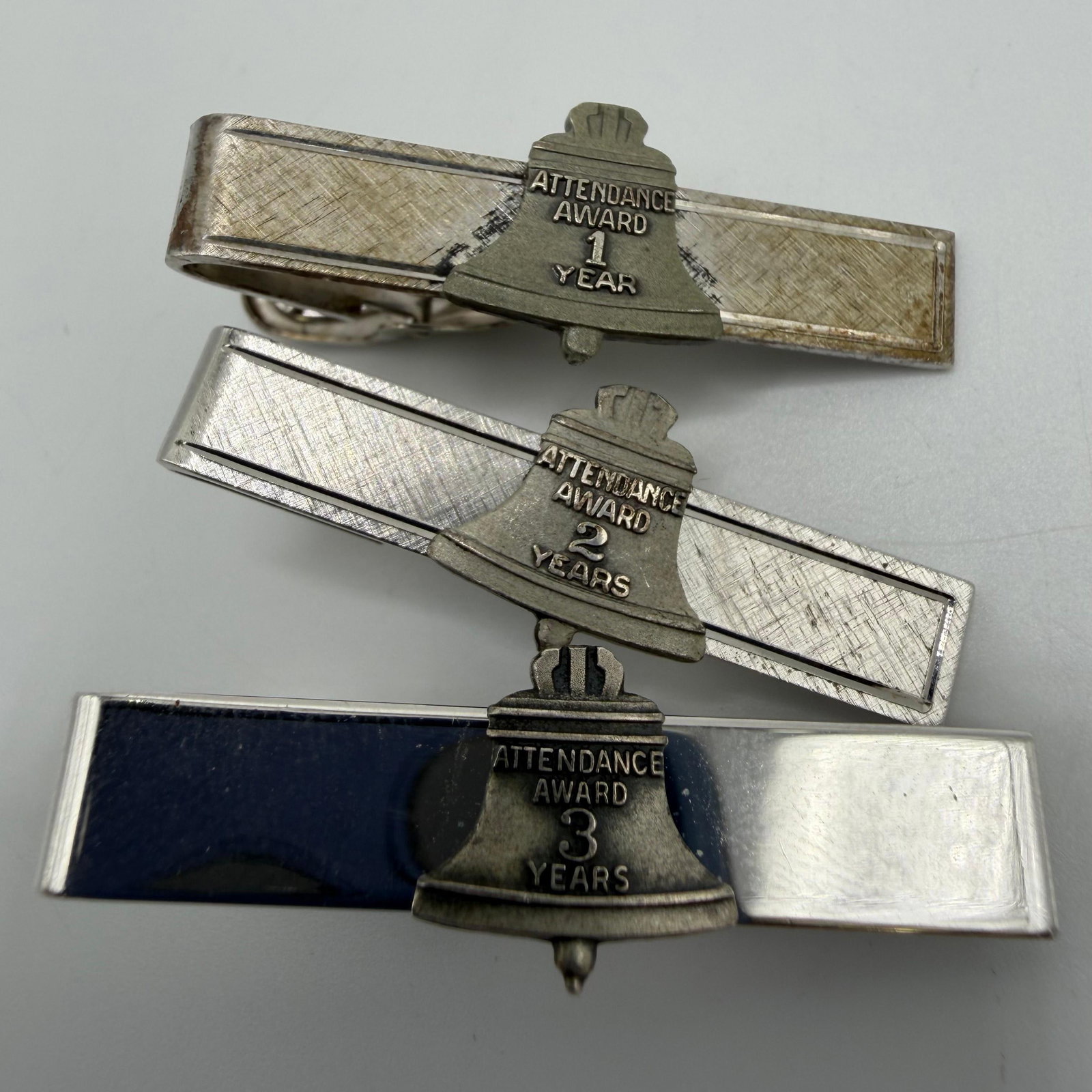 Sterling Silver Bell System Attendance Award Years of Service Tie Clip Set: These items are in good pre-owned, previously used/displayed condition with noticeable light wear and surface scratches. Please reference all photos for full details. These pieces of jewelry have been