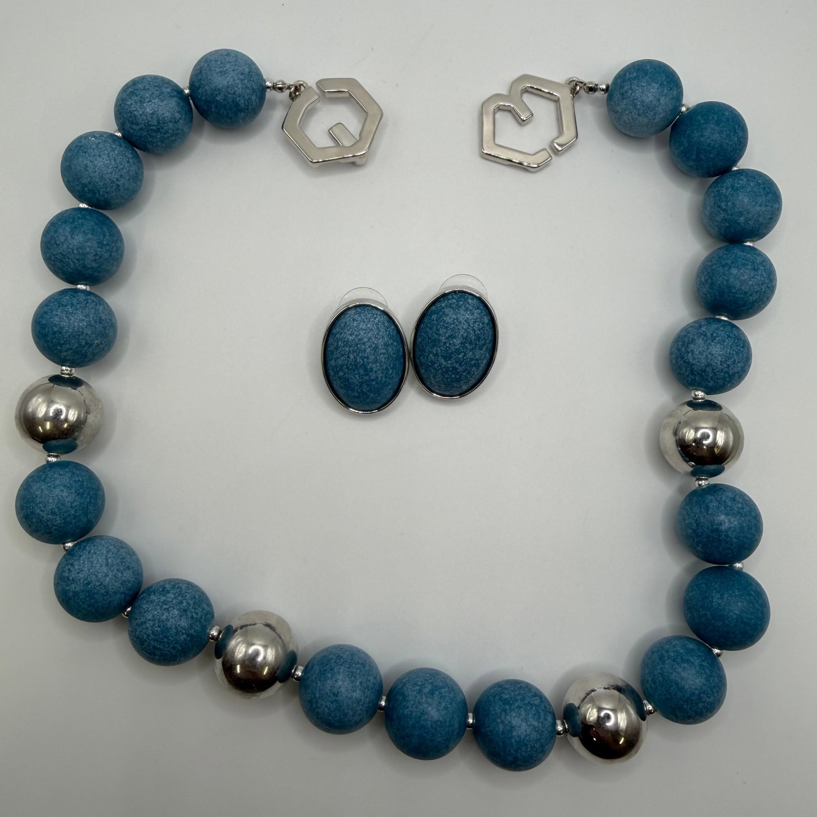 Kenneth Jay Lane Treasures of the Duchess Necklace and Earrings Jewelry Set: Signed Kenneth Jay Lane (KJL) Treasures of the Duchess boxed costume jewelry set including a blue frosted bead necklace with polished silver-tone accent beads and coordinating oval blue stud earrings.