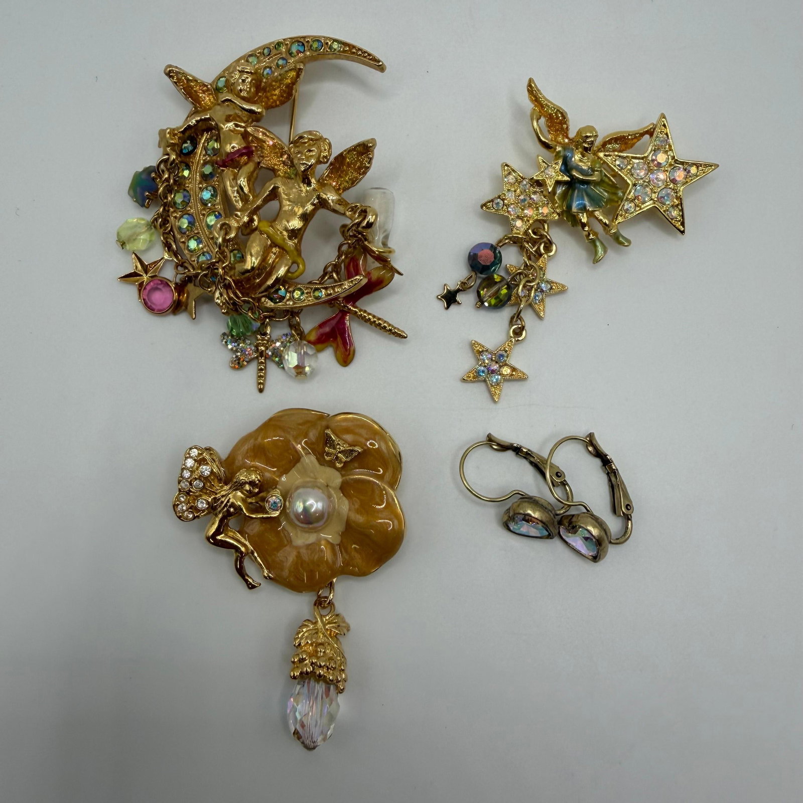 Kirks Folly Half Moon Cherub Celestial Brooch Set with Heart Shaped Earrings: Four-piece lot of Kirks Folly jewelry including three brooches and a pair of heart-shaped earrings. Each piece is marked Kirks Folly on the reverse. These items are pre-owned, with light wear, minor i