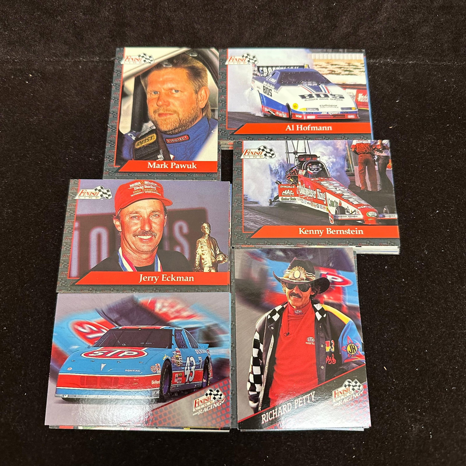NASCAR Racing Trading Card Lot Finish Line 120 Pc Petty Eckman Hofmann: A lot of approx. 120 NASCAR trading cards featuring drivers, including Richard and Kyle Petty, Al Hofmann, Mark Pawuk, Jerry Eckman, and others: mixed sets, loose cards, varying condition. The lot inc