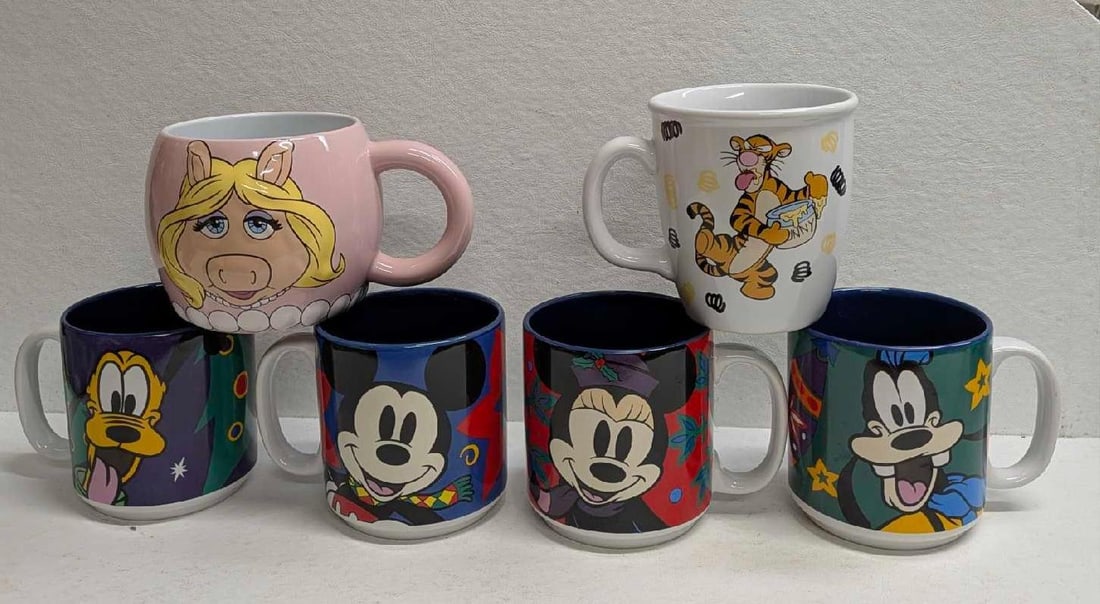 Disney Enchanted Christmas Tigger And Miss Piggy Mugs: Disney Enchanted Christmas Tigger And Miss Piggy Mugs. This lot includes: (1) Set Of 4 "An Enchanted Christmas" Christmas Character Mugs. The set comes in the original box that is approx 4"