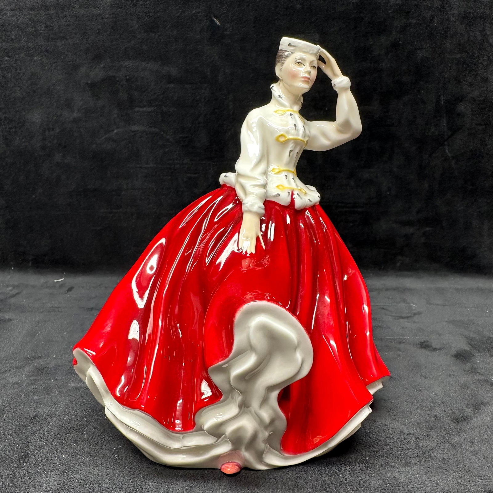 Royal Doulton Gail HN2937 Porcelain Lady Figurine Red Dress 1985: Royal Doulton porcelain lady figurine titled Gail HN2937. Marked on the underside Royal Doulton England with model number. No chips or cracks observed, light surface wear present. This item is in