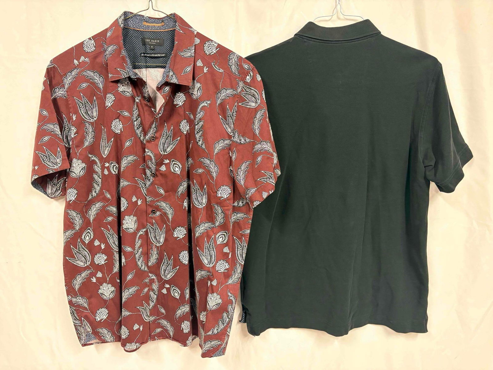 2PC Ted Baker and Robert Graham Burgundy and Black Casual Mens Shirt Bundle: This lot contains a set of men's short sleeve dress shirts. Both the Robert Graham (size Large) and Ted Baker (size 6) shirts are standing in like-new conditions without tags. Please refer