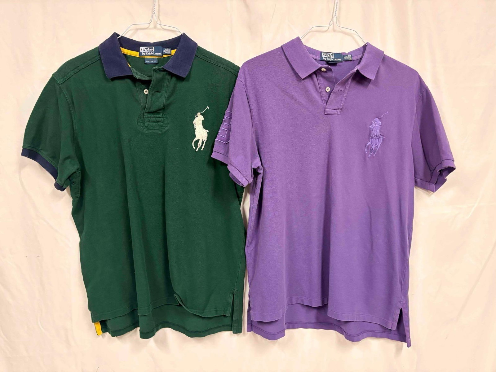 2PC Vintage Ralph Lauren Green and Purple Mens Polo Shirt Bundle: This lot contains a set of men's short sleeve dress shirts by Polo Ralph Lauren. Both shirts are a size Extra Large, standing in like-new conditions without tags. Please refer to images for furthe