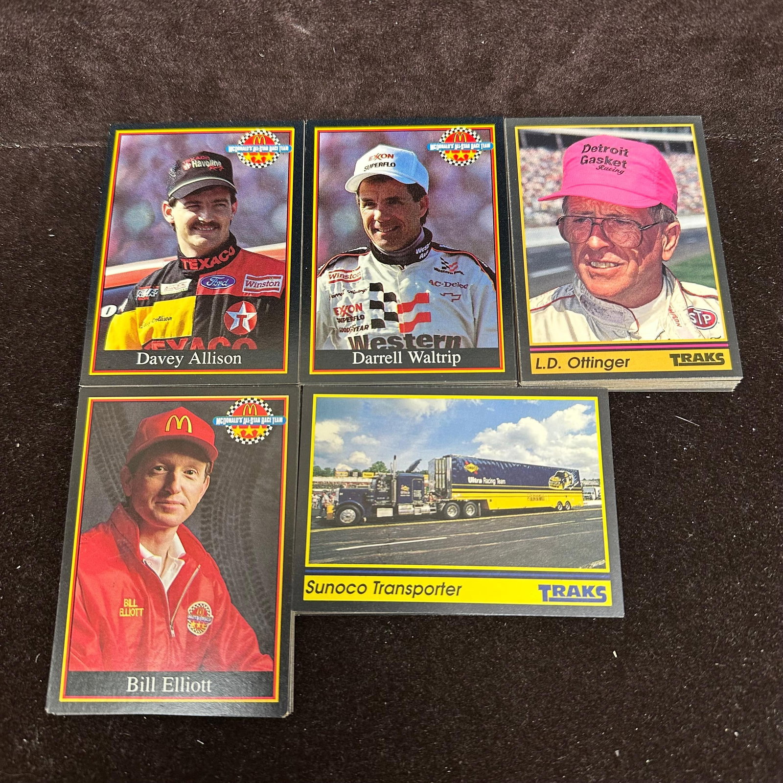 NASCAR Racing Trading Card Lot 100 Cards Maxx Traks 90s: A lot of approx. 100 NASCAR trading cards featuring drivers, including Ricky Rudd, Dave Marcis, Dick Trickle, Rick Wilson, and others: mixed sets, loose cards, varying condition. The lot includes