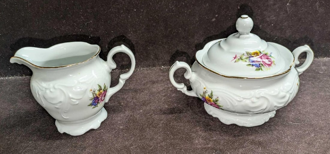 Retired Royal Kent RKT6 Sugar Bowl And Creamer: Retired Royal Kent RKT6 Sugar Bowl And Creamer. The creamer is approx 5 1/4" x 3 1/2" x 4" and the sugar bowl with lid is approx 7" x 5 1/4" x 5" and it weighs 1.43lb. Both do not have any cracks or
