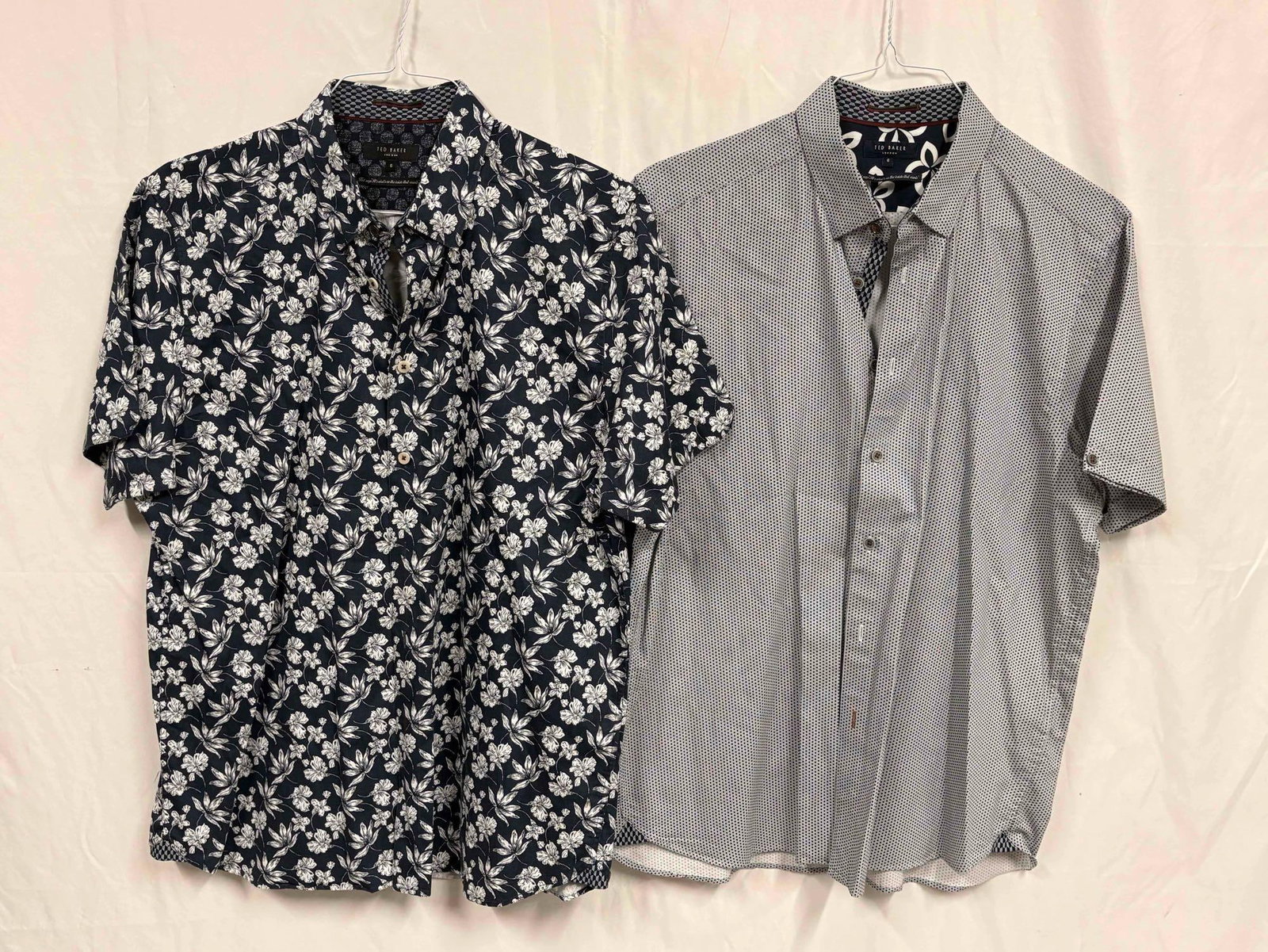2PC Ted Baker Monochromatic Mens Button-Up Shirt Bundle: This lot contains a set of men's short sleeve dress shirts by Ted Baker, a high-end menswear street brand brought up in London. Both shirts are a size 6, standing in like-new conditions without ta