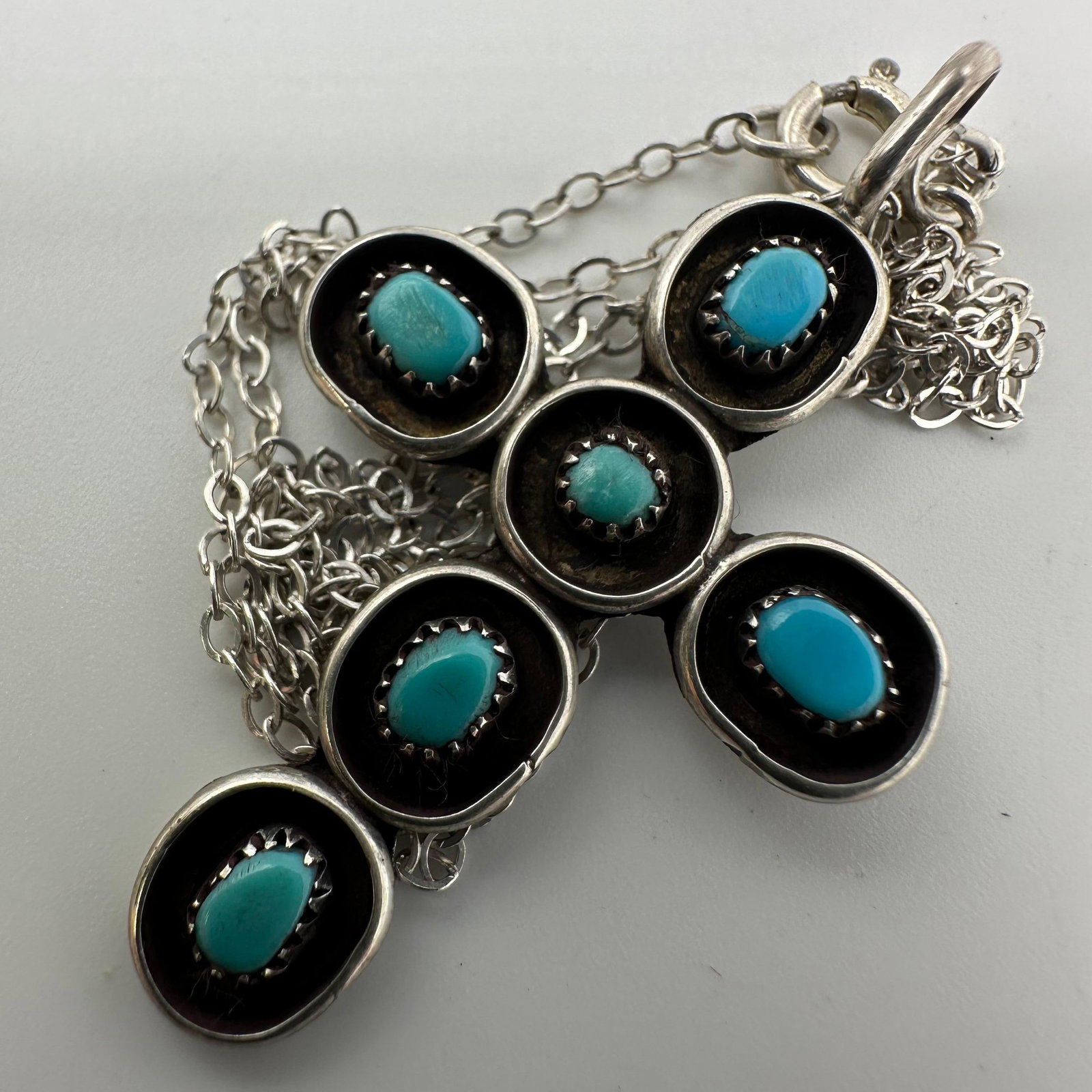 Turquoise Five Blue Stone Setting Cross Necklace Sterling Silver: This item is in good pre-owned, previously used/displayed condition with noticeable light wear and surface scratches. Please reference all photos for full details. This piece of jewelry has been teste