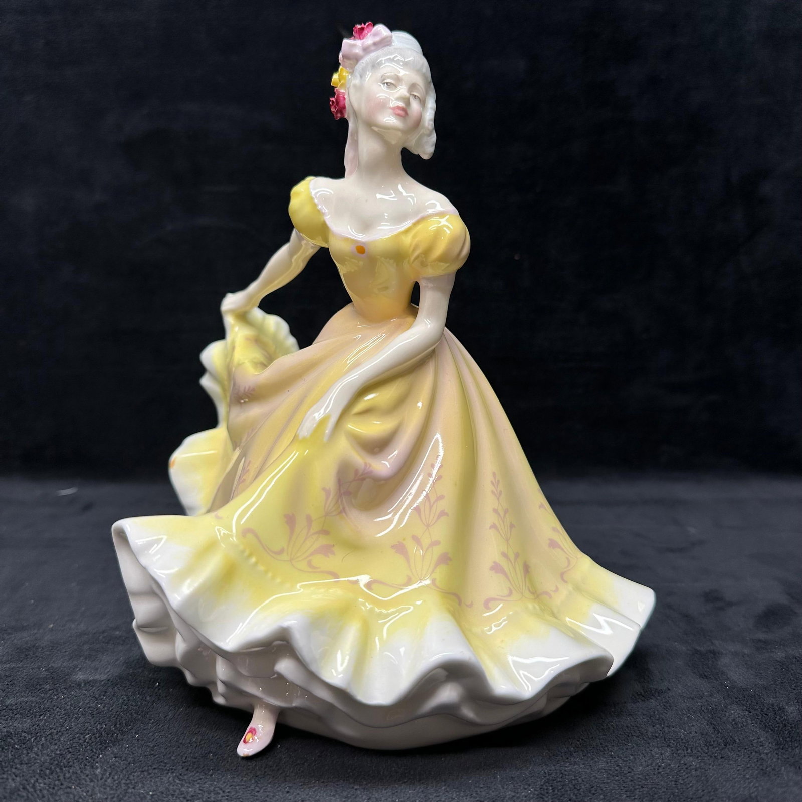 Royal Doulton Ninette HN2379 Porcelain Lady Figurine Yellow Dress: Royal Doulton porcelain lady figurine titled Ninette HN2379. Features a standing figure in a flowing yellow dress with floral accents and a bonnet. Marked on the underside Royal Doulton England with m
