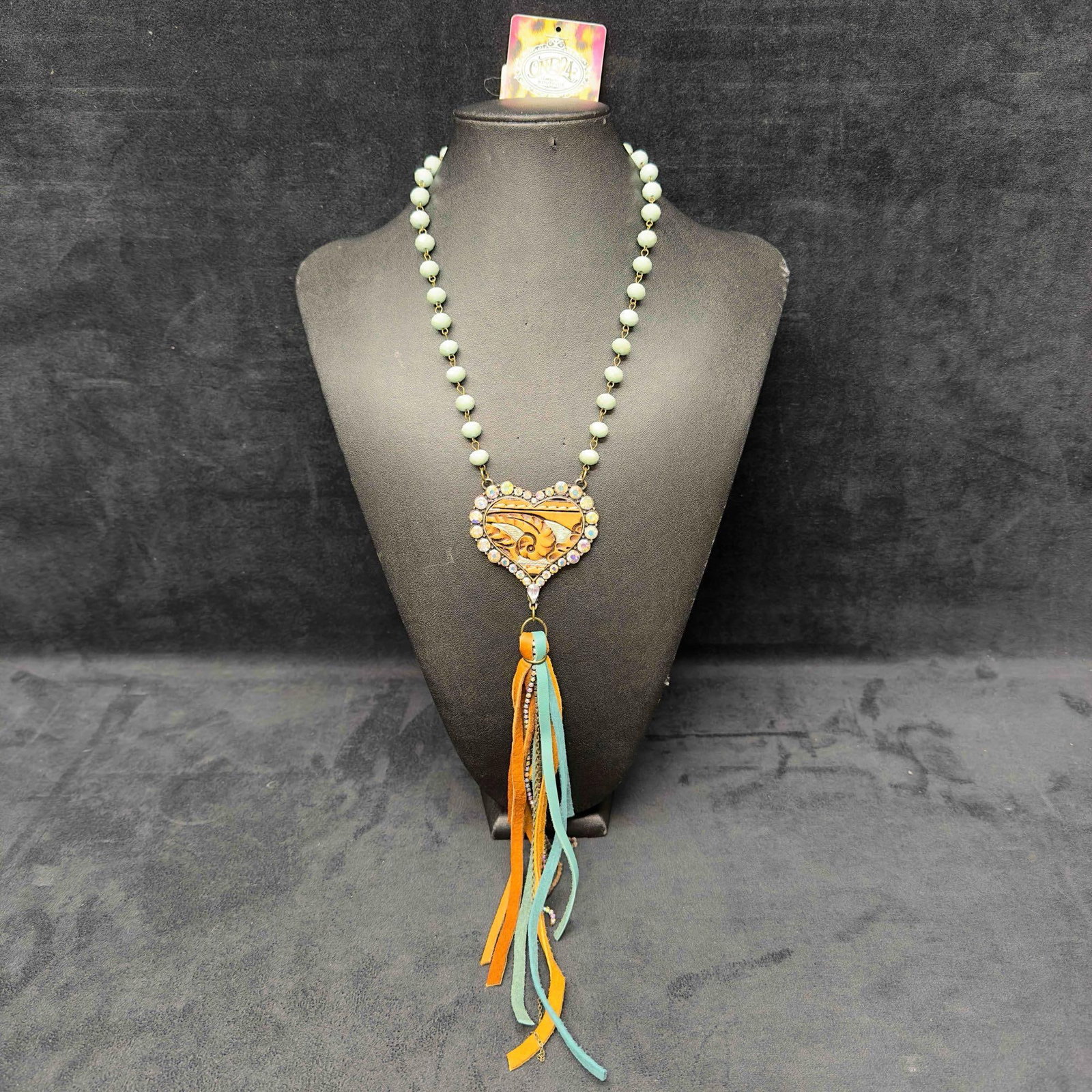 One 24 Boutique Southern Gal Turquoise Costume Jewelry Necklace: One 24 Boutique Southern Gal Turquoise Costume Jewelry Necklace. Necklace featuring rhinestones, turquoise colored accents, and a pendant with dangle accents. The necklace features a lobster claw clas