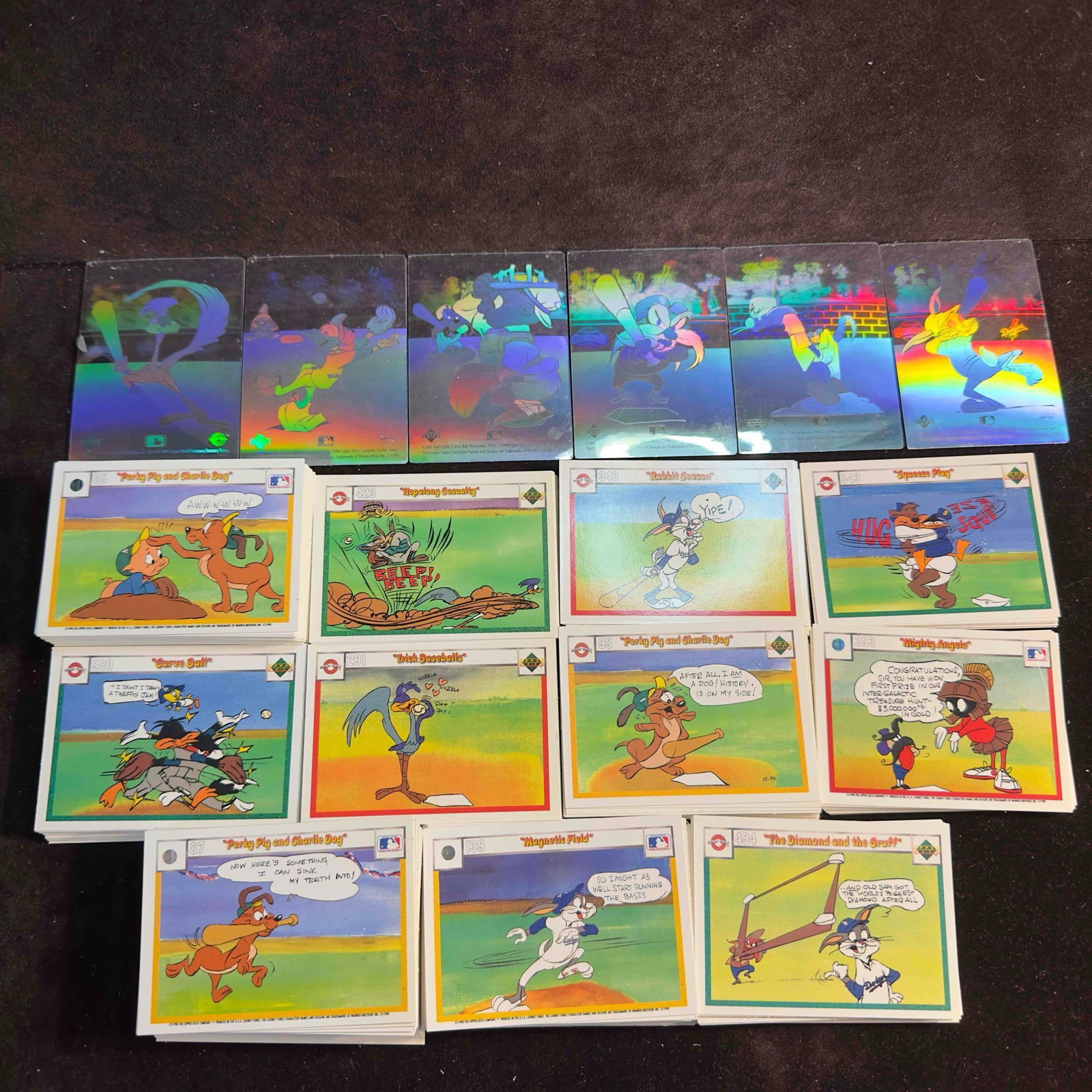 1990 Upper Deck The Looney Tunes Baseball Card Collection Set Hologram Cards: 1990 Upper Deck The Looney Tunes Baseball Card Collection Set Hologram Cards. This trading card lot includes a collection of Upper Deck Looney Tunes themed cards. Over 100+ cards included. Six hol