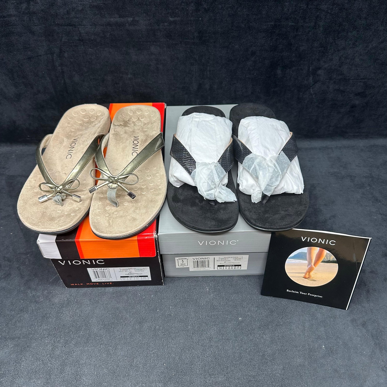 Vionic Womens Sandals Lot 2 Pairs Bella II and Hilda Woven Size 10: A lot of 2 pairs of Vionic women’s sandals, new in original boxes. Includes Bella II in pewter and Hilda Woven in black. Both pairs are marked women’s size 10. Appear unworn with original 