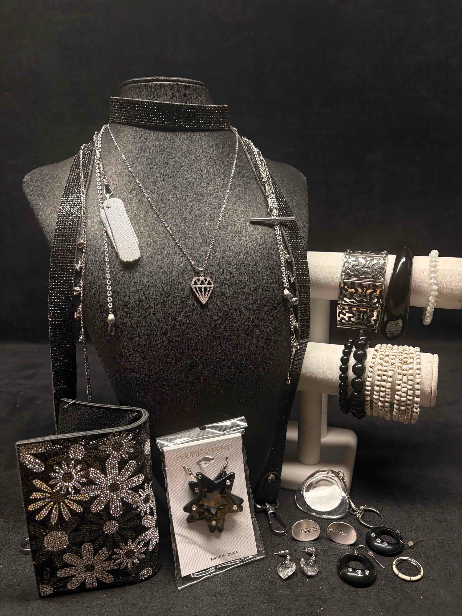 17pc Black White and Silver Rebels Regalia Costume Jewelry Collection: This lot contains 17 pieces of pre-owned costume jewelry, paired together in a stylized set. Each piece is in good conditions, with wear and tear over the years visible on some of the jewelry. Please