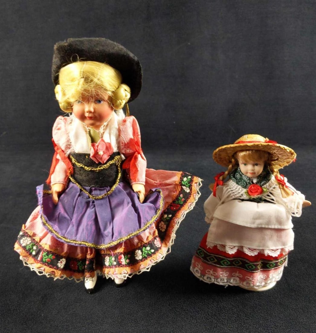 Two Vintage Little Girl Dolls With Hats: This lot consists of: (1) Small Doll With Stand. Has hand-painted porcelain hands, head and legs. Has blonde pig-tails under a straw hat. Doll is approx 3" x 2" x 6". Has some marking