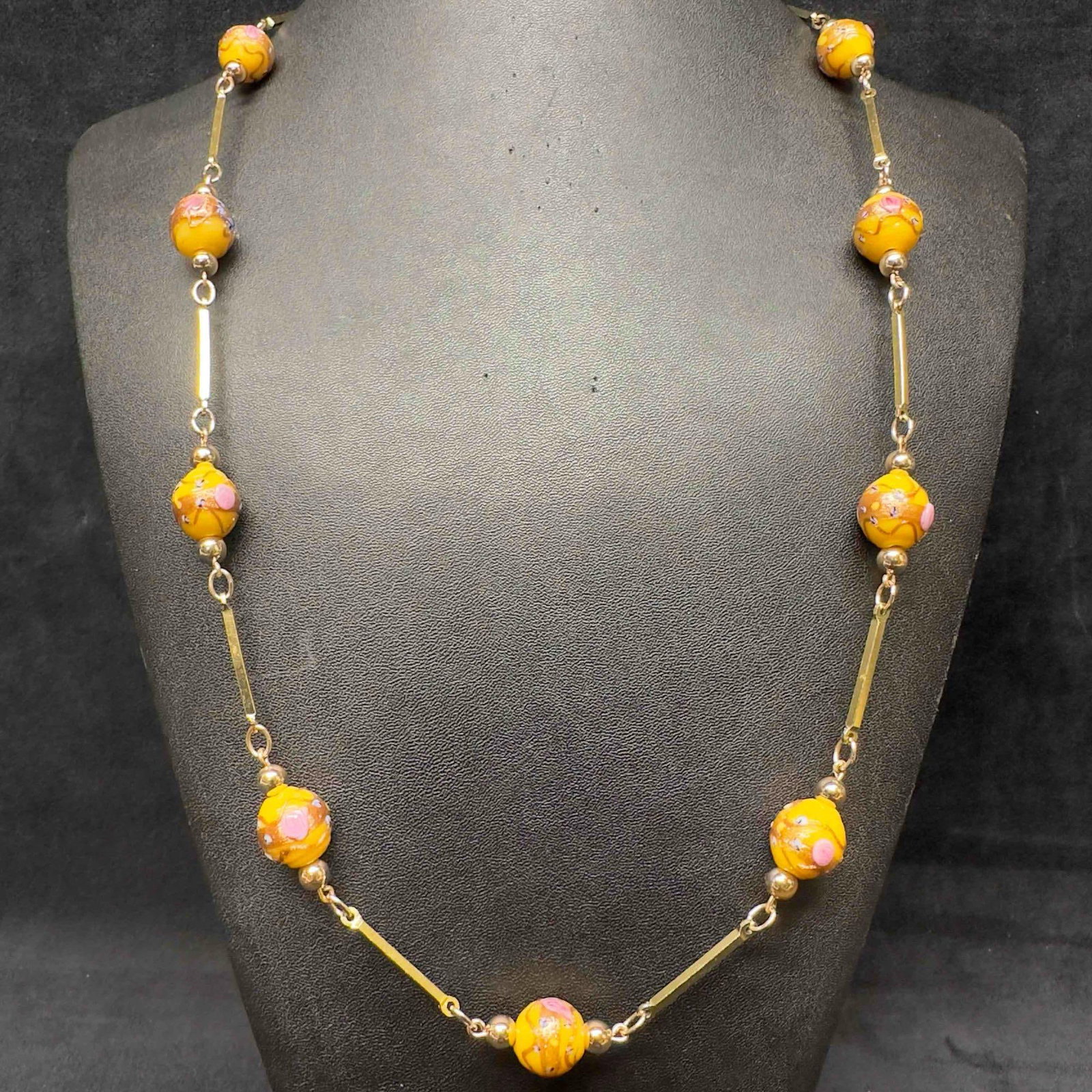 Venetian Murano Art Glass Lamp Work Yellow Bead Copper Floral Beaded Necklace E39: Venetian Murano Art Glass Lamp Work Yellow Bead Copper Floral Beaded Necklace E39. Necklace with yellow colored glass beads with beautiful hand painted designs on each. The necklace features pink colo
