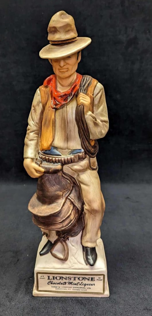 LE The Cowboy Porcelain Lionstone Decanter: LE The Cowboy Porcelain Lionstone Decanter. Made of porcelain. This comes in its original box which is approx 5 5/8" x 4" x 15 1/2" and it weighs 4.03lbs. The box has some shelf wear. 