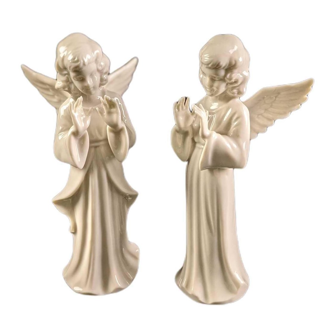 Two Dresden Porcelain Angel Conductors: This lot includes two conductor angels by Dresden Porcelain (Germany). They are approx 3" x 2" x 5 1/2". Both are in a good, vintage condition with no known damage. Together they weigh under one pound