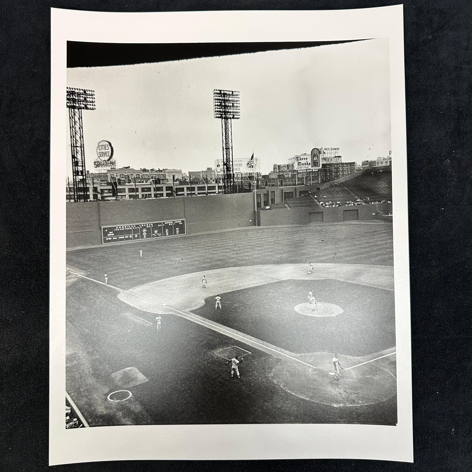 Black and White Silver Gelatin Print Fenway Park Baseball Game Scene Boston Red Sox: Black and white analog photo print capturing a wide view of Fenway Park during a game. The iconic Green Monster is visible in left field, along with period advertising signs such as Cities Service and