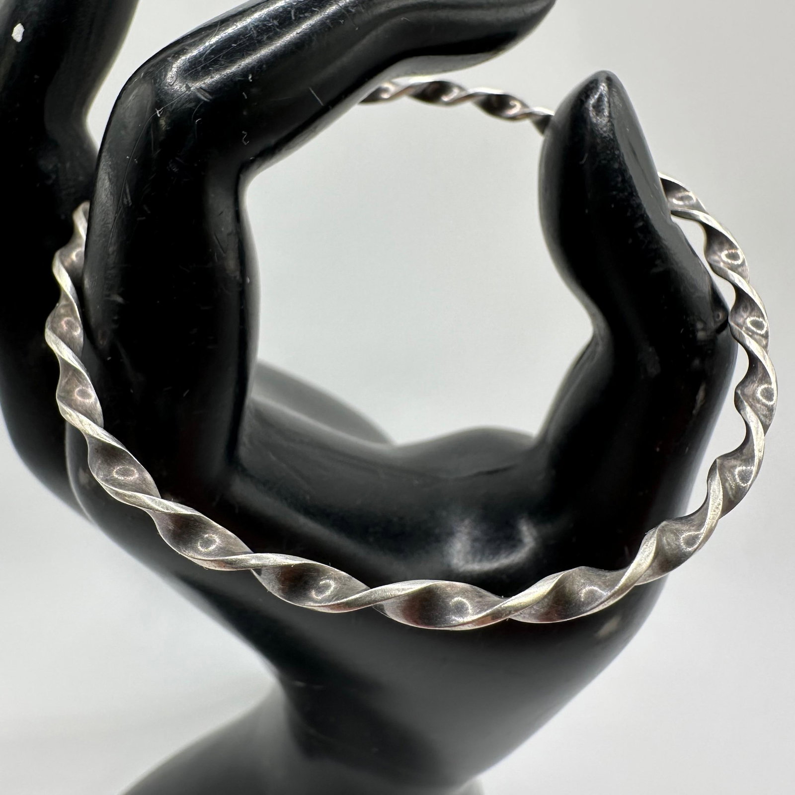 Silver Bangle Bracelet Twisted Twist Wire Style Design M45: This item is in good pre-owned, previously used/displayed condition with noticeable light wear and surface scratches. Please reference all photos for full details. This piece of jewelry has been teste