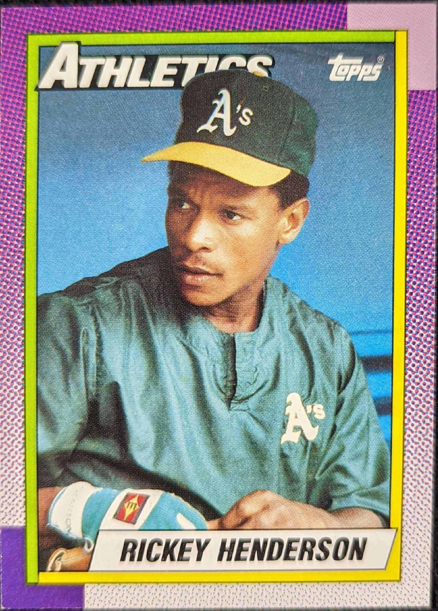 1990 Rickey Henderson Topps Baseball Card: 1990 Rickey Henderson Topps Baseball Card. This ungraded card has light wear around the corners. Please see the images as they are part of the description. The card is approx 2 1/2" x 3 1/2" and 