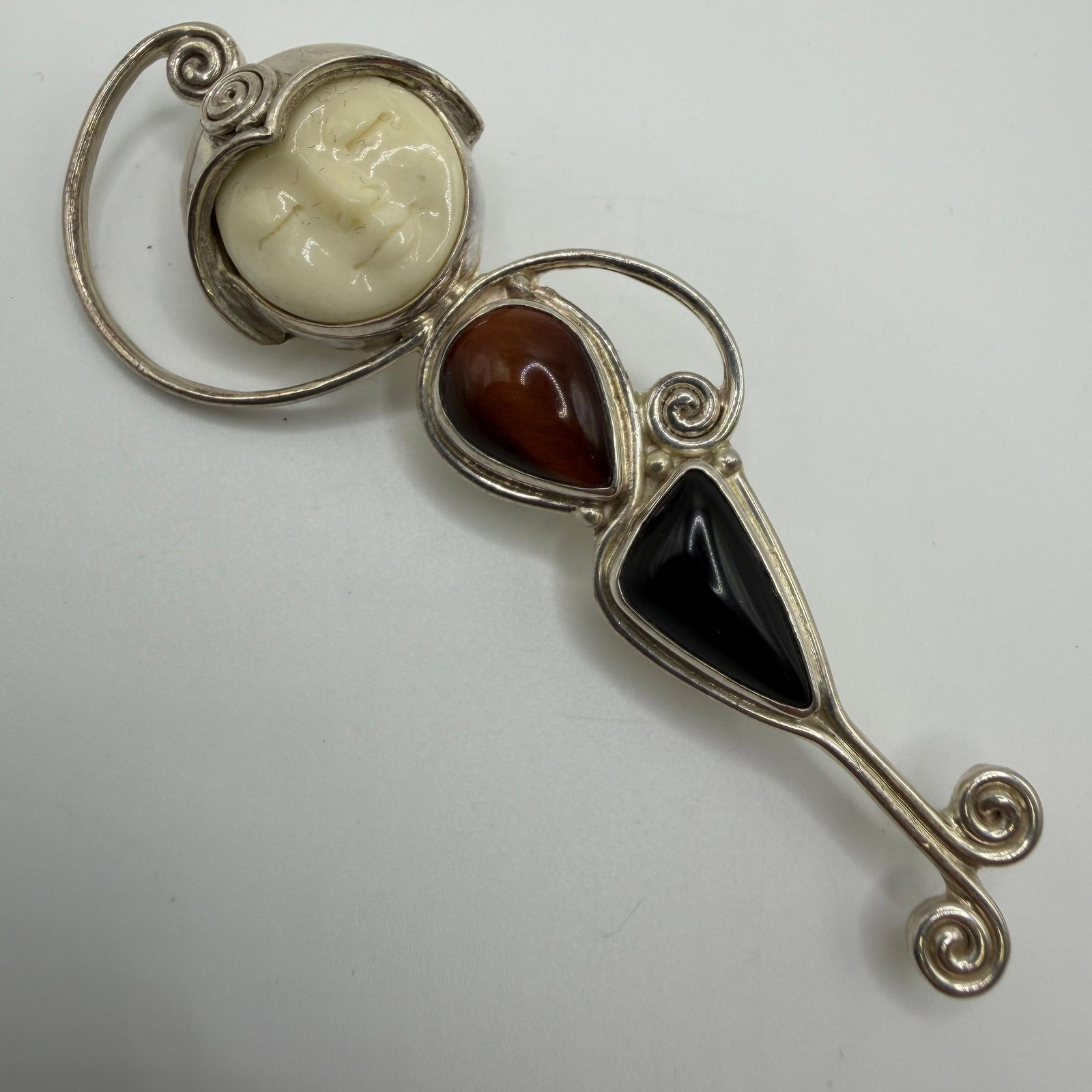 Sajen Carved Moon Face Goddess Sterling Pendant Brooch Tigers Eye Onyx: This item is in pre-owned, previously used/displayed condition with noticeable light wear and surface scratches. Please reference all photos for full details. This piece of jewelry has been tested and