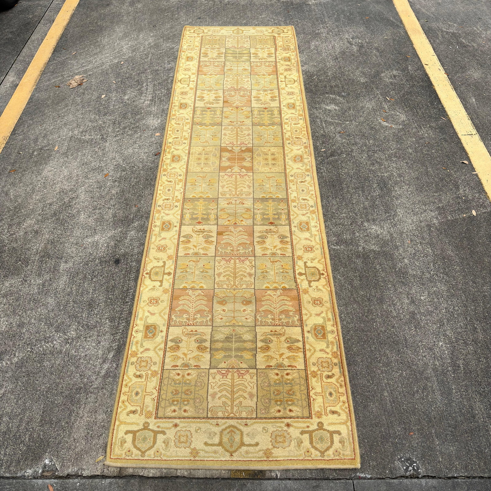 Karastan Wool Hallway Runner Rug Traditional Floral Panel Design: Karastan machine-made hallway runner rug featuring a traditional panel design with floral, botanical, and geometric motifs in soft ivory, sage, tan, gold, and muted blue tones. Includes the original K