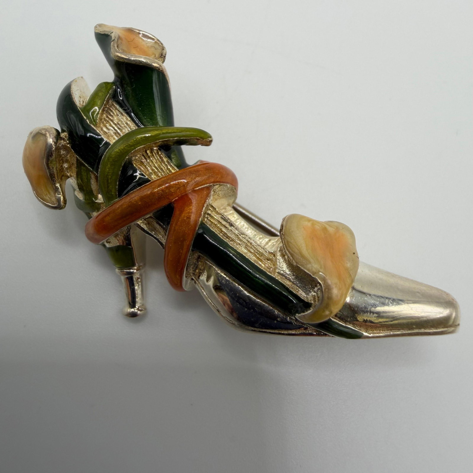KJL Kenneth Jay Lane High Heel Enamel Sterling Brooch Calla Lily Accent: This item is in pre-owned, previously used/displayed condition with noticeable light wear and surface scratches. Please reference all photos for full details. This piece of jewelry has been tested and