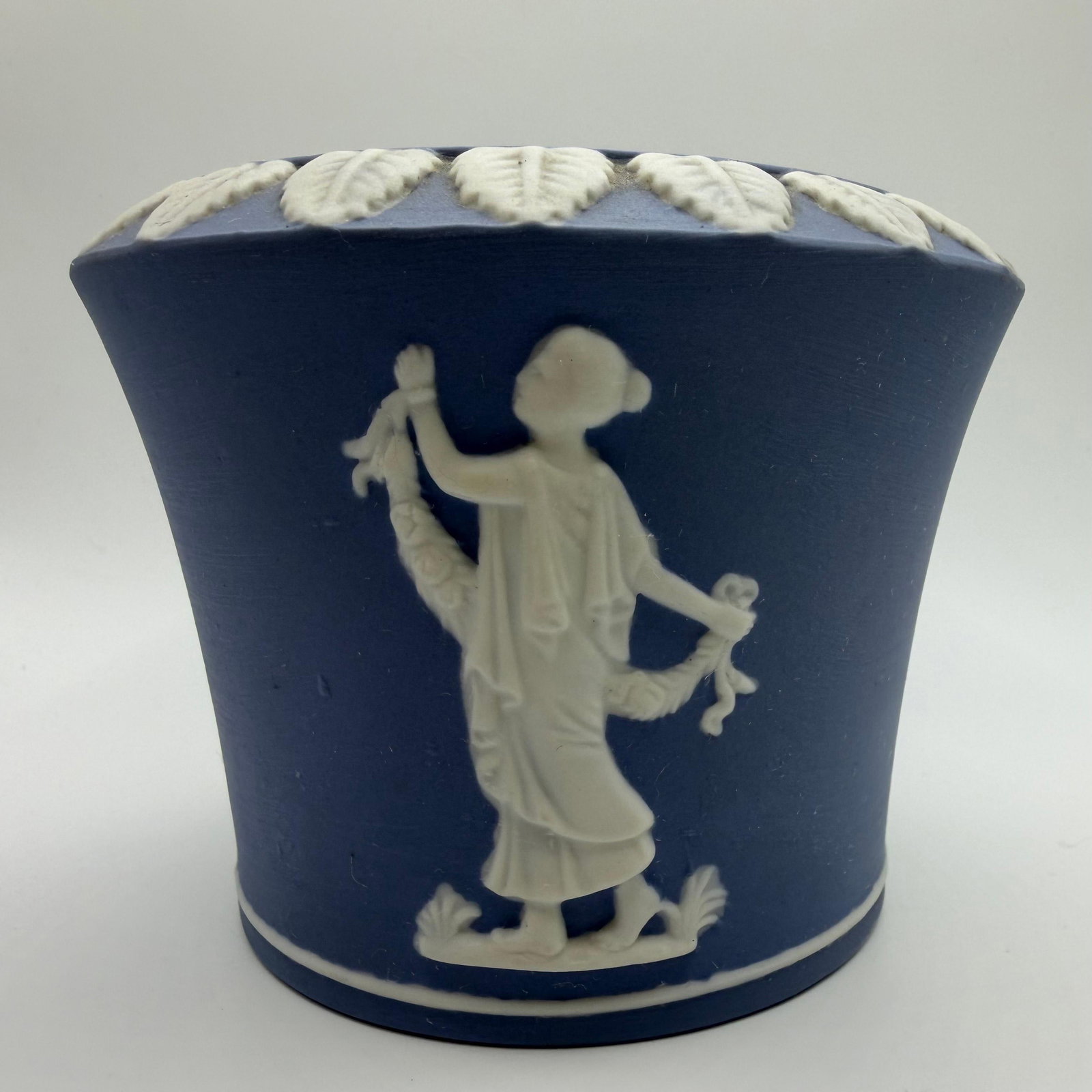Jasperware Posey Pot Blue Matte Finish Neoclassical Lefton: Classic blue jasperware posy pot featuring white applied neoclassical relief figures, floral garlands, and decorative borders. Light hallmarks on the bottom. Believed to be manufactured by Lefton