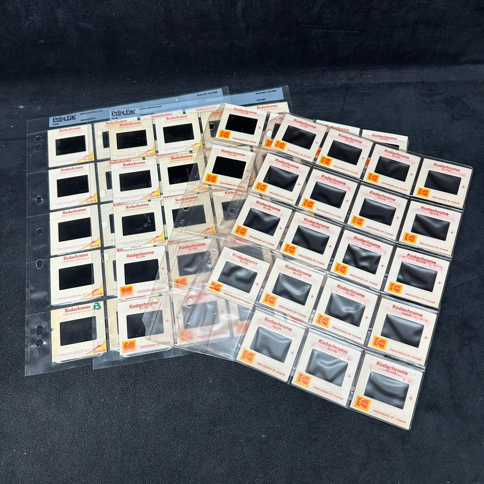 Kodak Kodachrome 35mm Travel and Nature Slide Collection: Collection of vintage Kodak Kodachrome 35mm color slides housed in archival plastic pages. Includes travel, tropical beach, jungle, cultural, market, food, portrait, and nature photography subjects. A