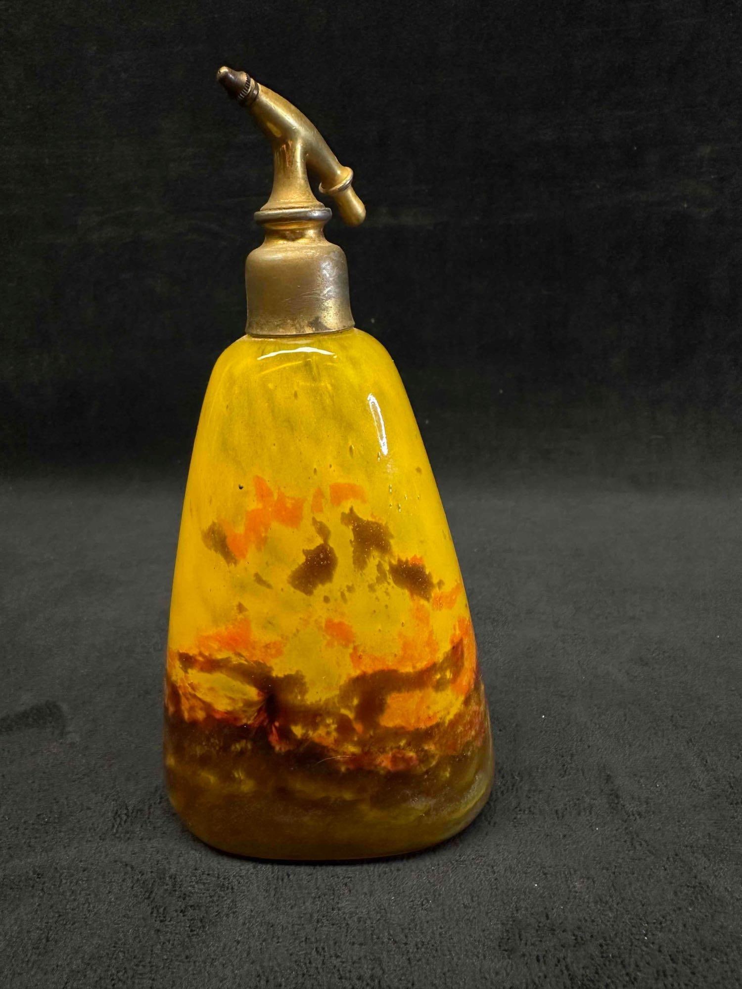 Antique Art Nouveau Muller Freres Perfume Atomizer: Antique Art Nouveau Muller Freres Perfume Atomizer This Art Nouveau atomizer was made by Muller Freres in Luneville, France. The base is handblown multicolored glass, with the Mu