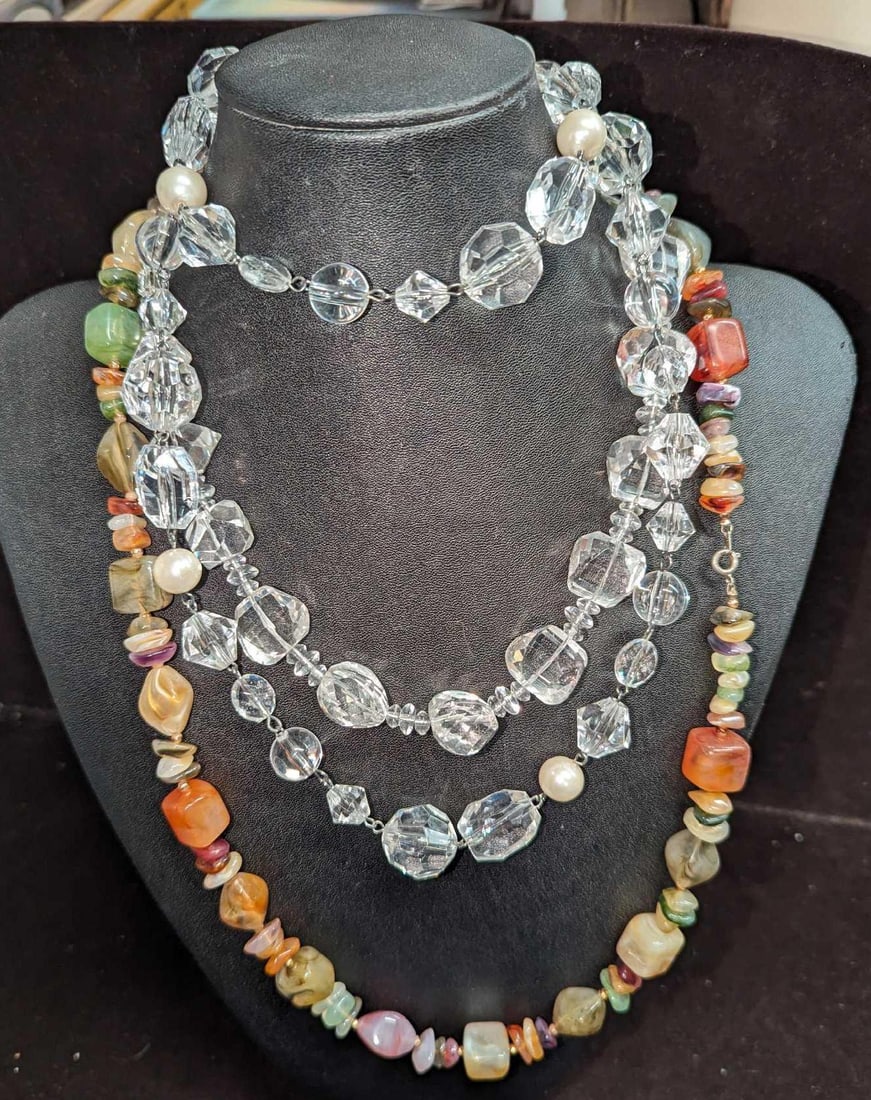 3 Clear Lucite & Acrylic Necklaces: 3 Clear Lucite & Acrylic Necklaces. This lot includes: (1) Multi-color Acrylic Stone Necklace. This is approx 28". (1) Lucite & Pearl Necklace. This is approx 34". (1) Clear Cut