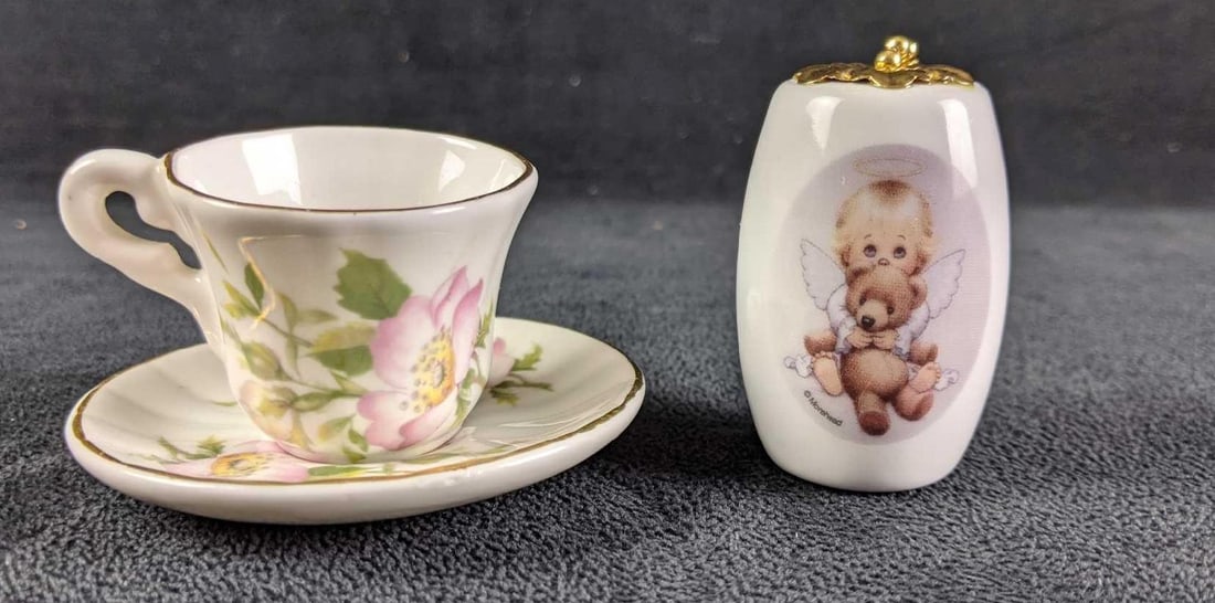 Tiny Teacup and Saucer and Porcelain Fan Pull: Tiny Teacup and Saucer and Porcelain Fan Pull These are small decorative additions to your home that are just so cute. They are in good used condition. The fan pull comes in its original box. 