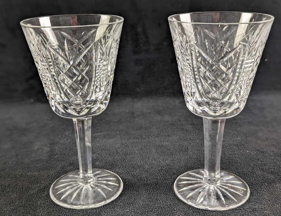 Two Retired Waterford Crystal Clare Cut Goblets: Two Retired Waterford Crystal Clare Cut Goblets. This design was released from 2000 to 2017. Each goblet is approx 3" x 3" x 5 3/4" and together they weigh 1.79lb. The goblets are in a good, unused co