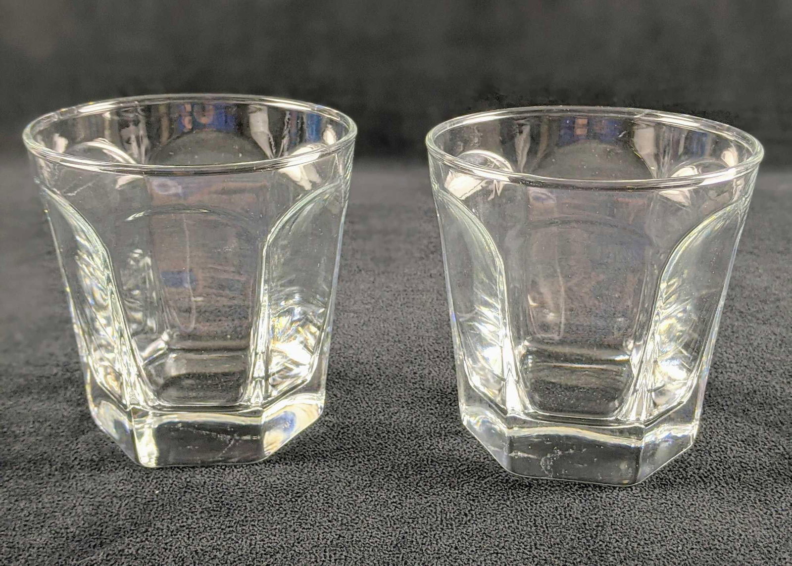 Two Vintage Single Rocks Drinking Glasses: Two Vintage Single Rocks Drinking Glasses. These appear to be made by the Jeanette Glass Company due to its markings on the bottom, which are slightly worn. Glasses are approx 4" x 4" x 4" and are in 