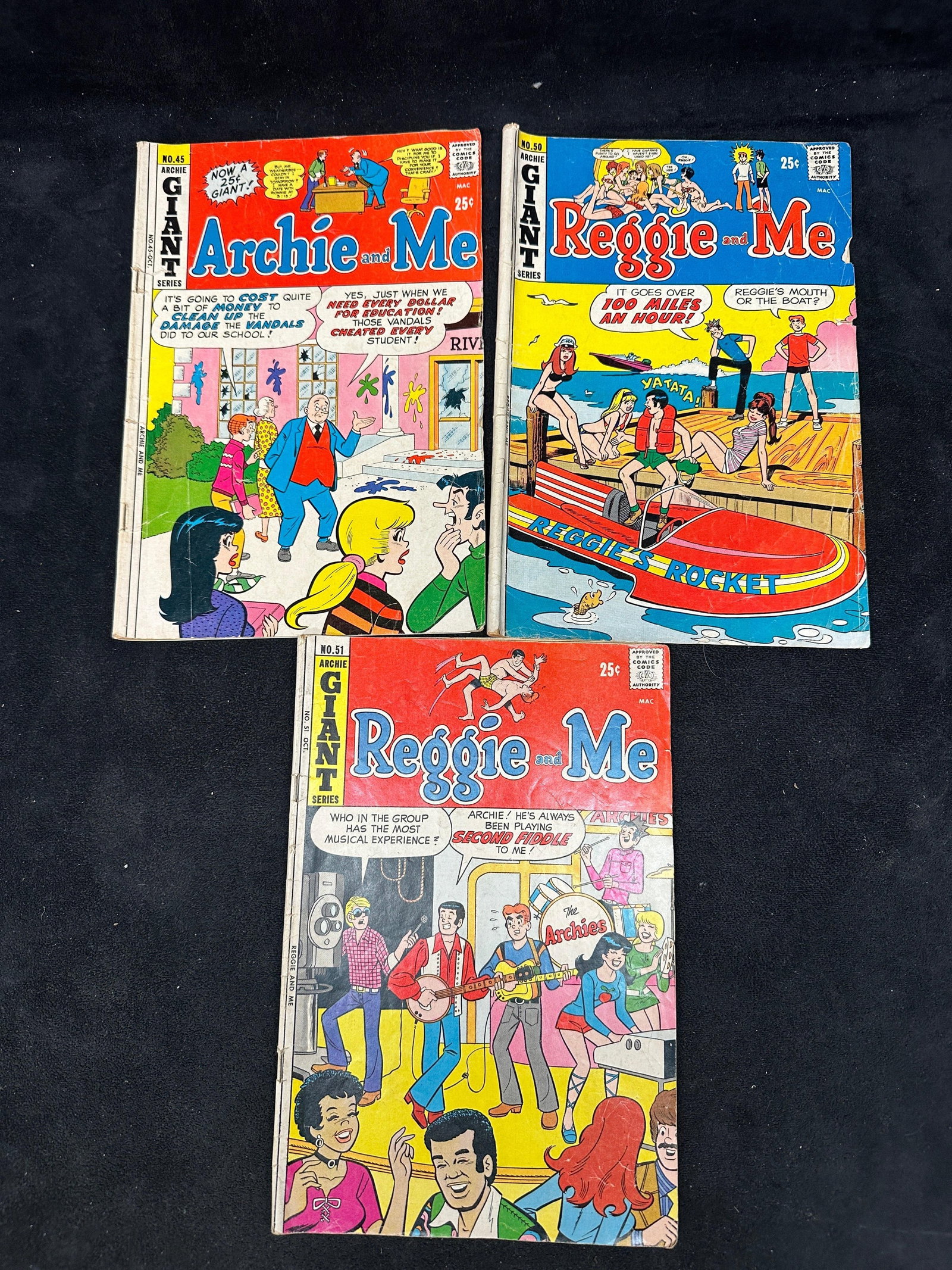 Archie Giant Series Comic Book Lot Reggie And Me Archie And Me: A lot of three vintage Archie Giant Series comic books, including Archie and Me No. 45 and Reggie and Me Nos. 50 and 51. Color comic book lot with visible wear, creasing, edge wear, and age-related