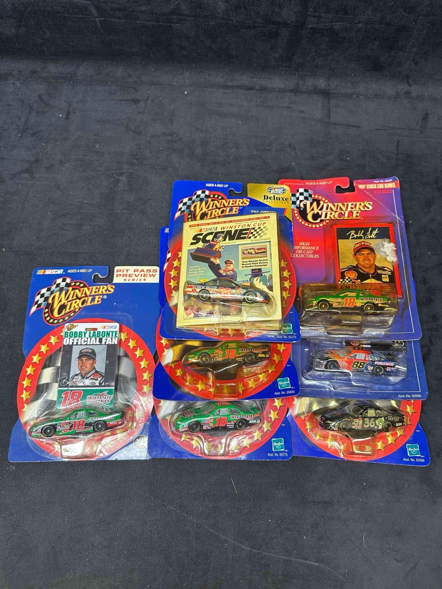 Winner’s Circle NASCAR Die-Cast Cars Bobby Labonte Dale Jarrett Dale Earnhardt Jr. and More: Collection of seven Winner’s Circle 1:64 scale die-cast stock cars, all sealed in original packaging. Includes Bobby Labonte Interstate Batteries cars, Dale Jarrett Ford Credit car, Dale Earnhar