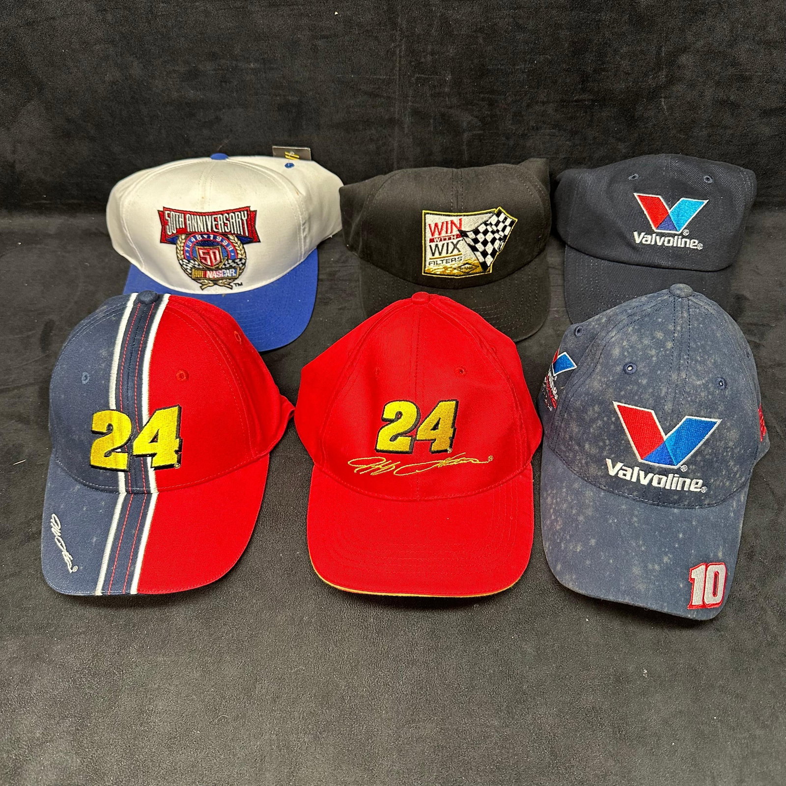 NASCAR Racing Hat Valvoline Jeff Gordon Set of Six: Six NASCAR hats included. A few of the hats still have the original tags intact. Minor wear and staining. These items are in pre-owned, previously displayed condition with light wear and surface marki