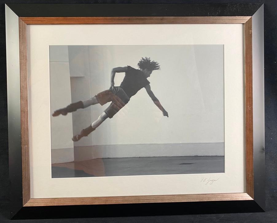 Frank Juge "Flight from Gravity" Photo: Frank Juge "Flight from Gravity" Photo Photo by Frank Juge, showing a man doing an acrobatic stunt, defying gravity as he almost appears to lay still in the air. Comes professionally