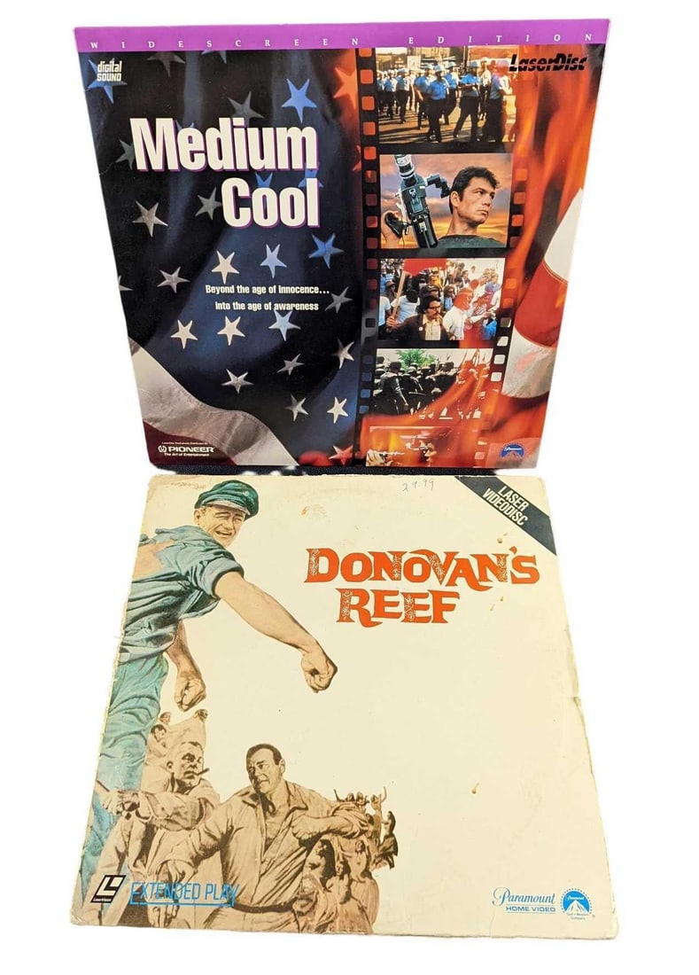 Medium Cool & Domovan's Reef Laserdiscs John Wayne: This lot includes: (1) Donovan's Reef. This was released by Paramount Home Video 1982. (1) Medium Cool. This was released bt Pioneer in 1995. Widescreen Edition. Both are approx 12 1/4" x