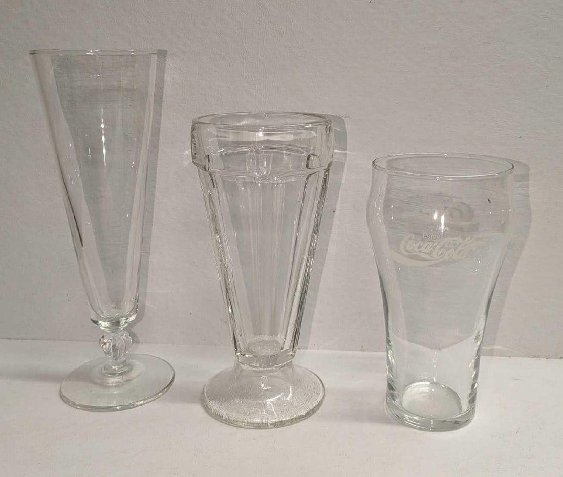 3 Vintage Coca-Cola Tall Beer Soda Fountain Glasses: 3 Vintage Coca-Cola Tall Beer Soda Fountain Glasses. This lot contains: (1) Vintage Tall Beer Glass. This is approx 2 3/4" x 2 3/4" x 8 1/2". (1) Vintage Soda Fountain Glass. This is