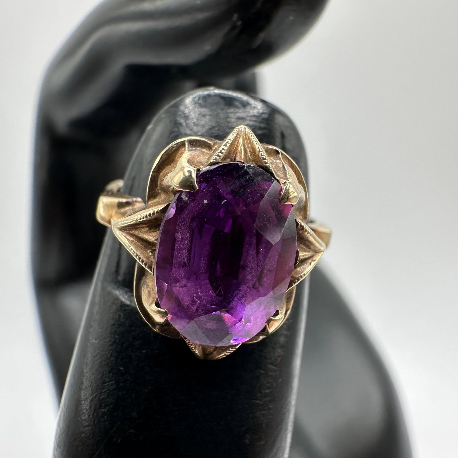Oval Cut Faceted Amethyst 10K Gold Ring: This item is in good pre-owned, previously used/displayed condition with noticeable light wear and surface scratches. Please reference all photos for full details. This piece of jewelry has been