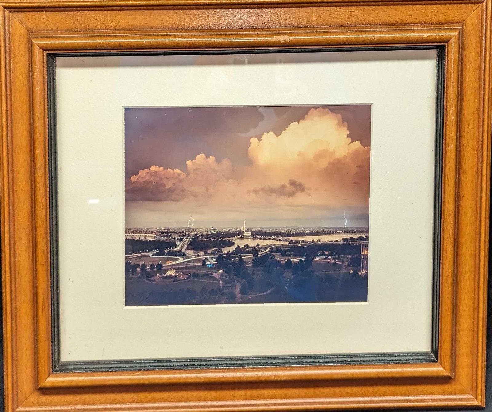 Framed Lightning At Washington, D.C. Photo: Framed Lightning At Washington, D.C. Photo. This is approx 17 5/8" x 1 3/4" x 14 1/22" and it weighs 3lbs. The frame has chips and the backing is loose. The photo was not marked or signed by the